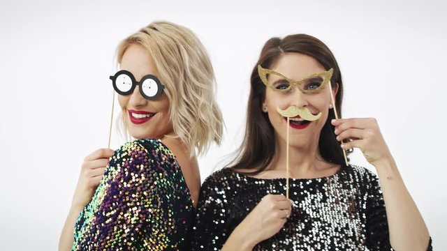 Glamorous women with photo booth partying