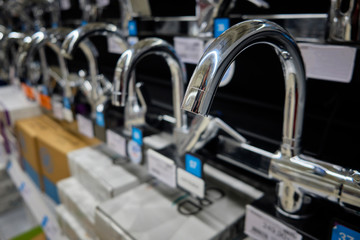 Row of brand new chrome colored water faucets