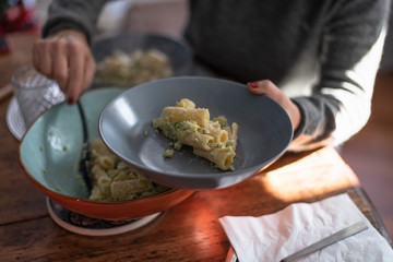 Preparing Delicious Pasta with Broccoli in a Sunlit Kitchen in Rome