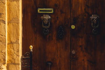 Old vintage weathered wooden door of Malta