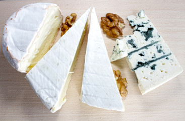 Soft cheese and blue cheese on a wooden board