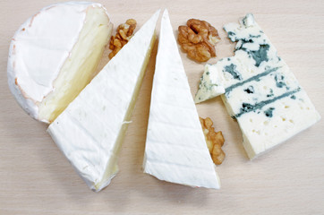 Soft cheese and blue cheese on a wooden board
