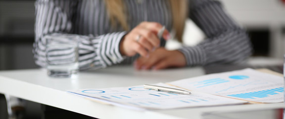 Macro shot of clerk sitting with pen