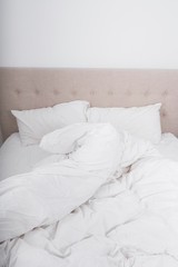 Fototapeta na wymiar Messy bed in bedroom