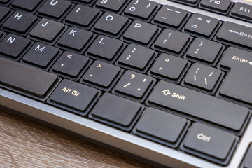 Close up of black keyboard on office desk.