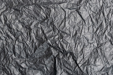 Black crumpled paper texture background with place for text or copy space