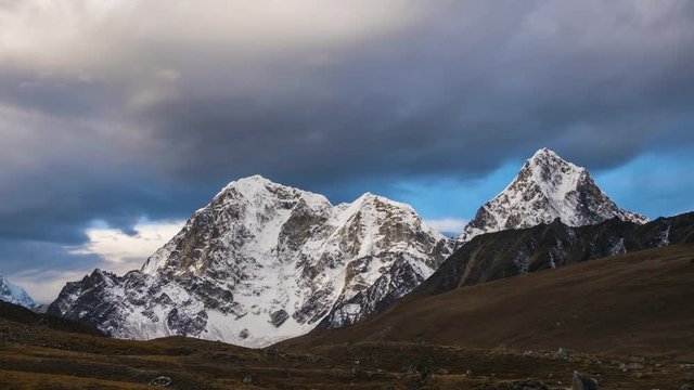 Taboche and Cholatse Mountains and Cloudy Sky in the Morning. Himalaya, Nepal. Timelapse