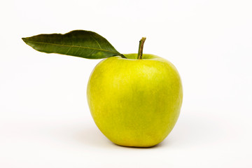 green apple with leaf isolated on white