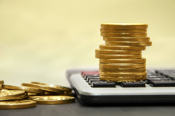 gold coins on a calculator. Close-up. Business concept. Concept of saving and saving money.
