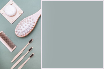 Eco-friendly products on a green background. Personal hygiene products made of bamboo and wood.