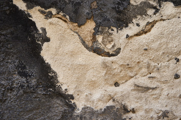 Background texture. Hard old painted black wall in grunge style. Surface for design and text. Close up view