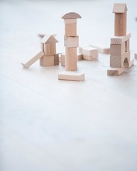 Wooden building blocks on hardwood floor