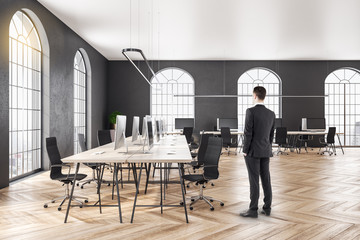 Businessman standing in coworking office