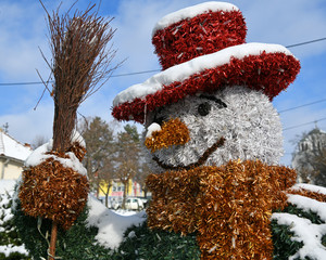 Beautifully decorated Snowman. Snowman with a hat, broom and scarf.