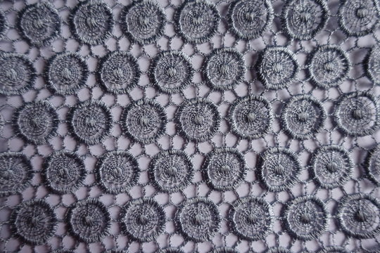 Top view of silver grey lacy fabric