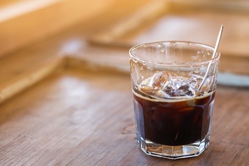 A glass of ice americano in coffee cafe