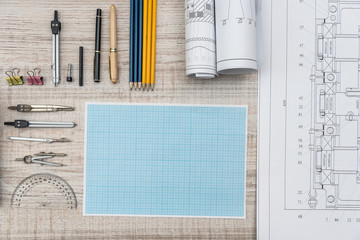 Technical drawing with millimeter paper and drawing tools. Mathematics and engineering