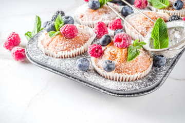 Muffins or cupcakes with berries