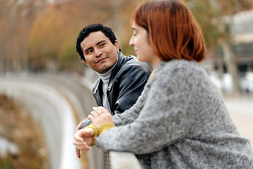 Happy couple looking at themselves and smiling