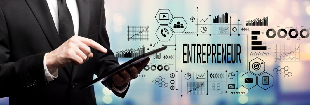 Entrepreneur concept with businessman using his tablet computer