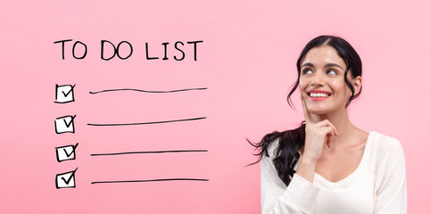 To do list with young woman in thoughtful pose