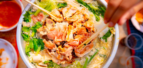 Grilled pork on pan and vegetables in soup, food concept in Thailand of Asian