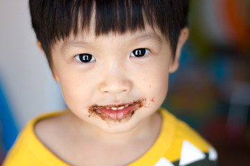 happy kids with face covered in chocolate
