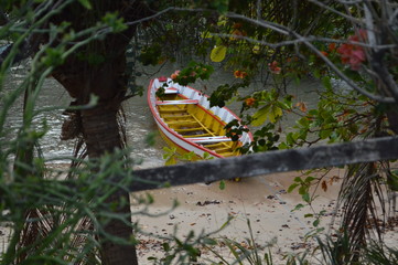 old yellow boat in the sand