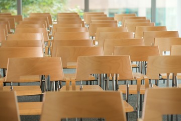 Rows of empty chairs in office