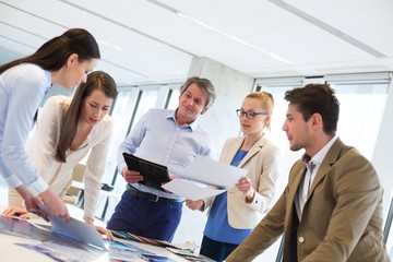 Male and female design professionals working on new project at office