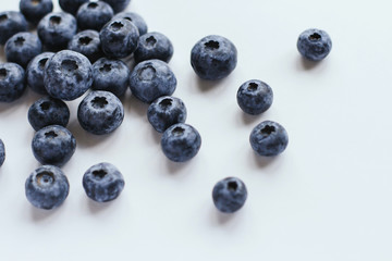  Ripe blueberries on a white background copy space. Large blue berries. Summer harvest of berries. Blueberry treat.