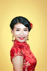 Portrait of young attractive chinese bride wearing traditional costume