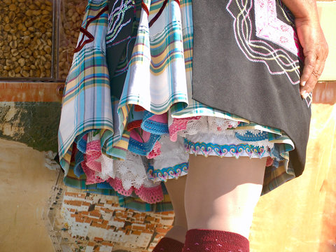 Traditional portuguese woman wearing a skit with 7 petticoats in Nazare in Portugal