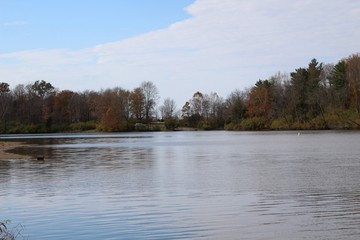 A peaceful view of the lake in the countryside. 