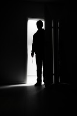 Obraz premium Full-length of burglar entering into house