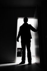 Fototapeta premium Full-length of thief entering into house