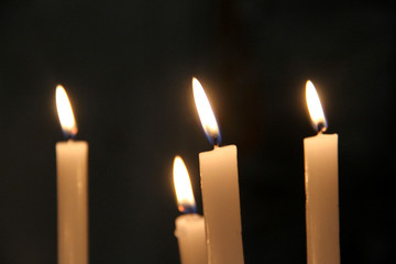 Candle flame isolated on a black background . Burning candles isolated on a black background 
