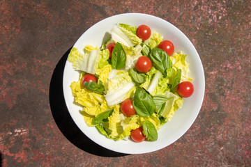 Healthy vegetarian vegan lunch dinner salad bowl  tomato, green vegetable vegetables Top View From Above on a rusty metallic table background