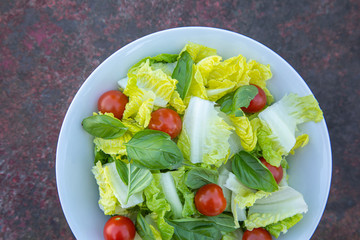 Healthy vegetarian vegan lunch dinner salad bowl  tomato, green vegetable vegetables Top View From Above on a rusty metallic table background