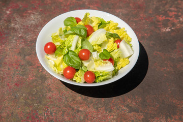 Healthy vegetarian vegan lunch dinner salad bowl  tomato, green vegetable vegetables Top View From Above on a rusty metallic table background