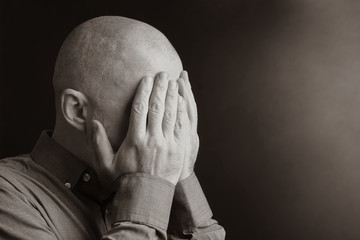 portrait of a man with closed hands face