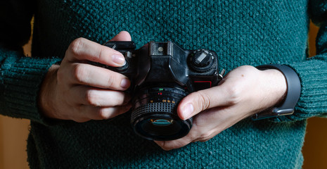 Man with an analog camera. SLR camera