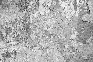 Texture of a concrete wall with cracks and scratches which can be used as a background