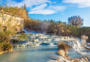Saturnia (Tuscany, Italy) - The thermal sulphurous water of Saturnia, province of Grosseto, Tuscany region, during the winter - obrazy, fototapety, plakaty