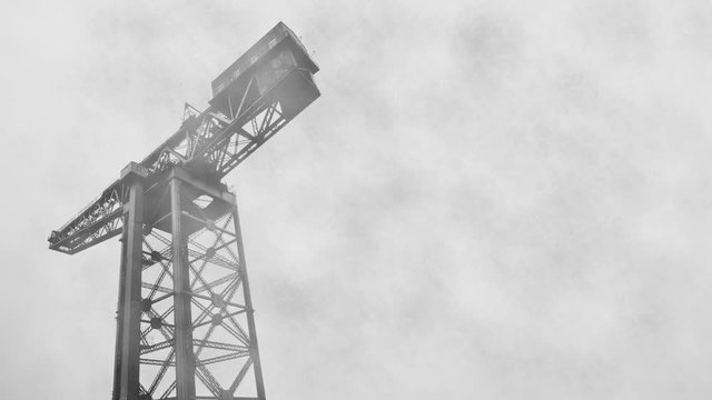 Fog Rolling By An Industrial Shipbuilding Crane With Copy Space