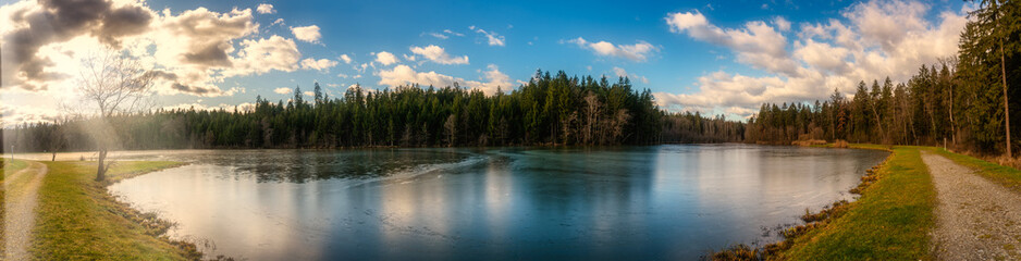 Panorama view at Wundschuher See in Wundschuh, Styria, Austria near Graz. View at forests and lake.Landscape