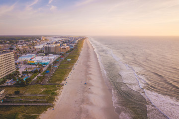 Aerial view of City, Ocean and Beach at sunrise