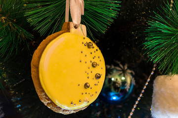 Close-up, Christmas tree decorated with toys. Christmas gingerbread decorates the holiday tree. Christmas background, holiday background. Winter, holiday, christmas.