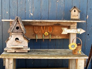 Hand crafted bird houses on wood table