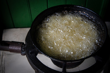 French fries potatoes boiled and cooked on oil.